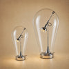Les deux tailles de la lampe chromée côte à côte, Ø 17 et Ø 25 cm | Delvanie