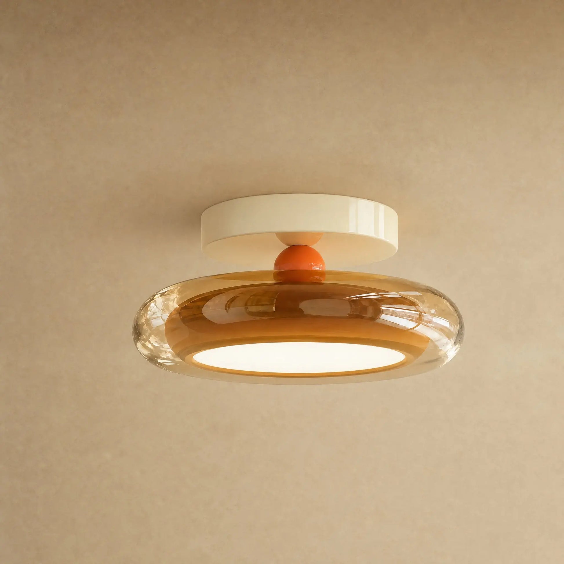 Plafonnier en verre ambré et platine crème, galet Prismya | Delvanie