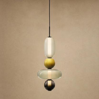 Suspension verre coloré Zuccara, quatre perles à bille jaune et galet olive, hauteur 50 cm