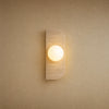 Applique murale globe en travertin naturel, une sphère de verre opalin, modèle Barre 1 Globe | Delvanie
